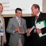 R. Barbucci receiving the award from M. Barbosa, president of the award committee, and L. Ambrosio, ESB president
